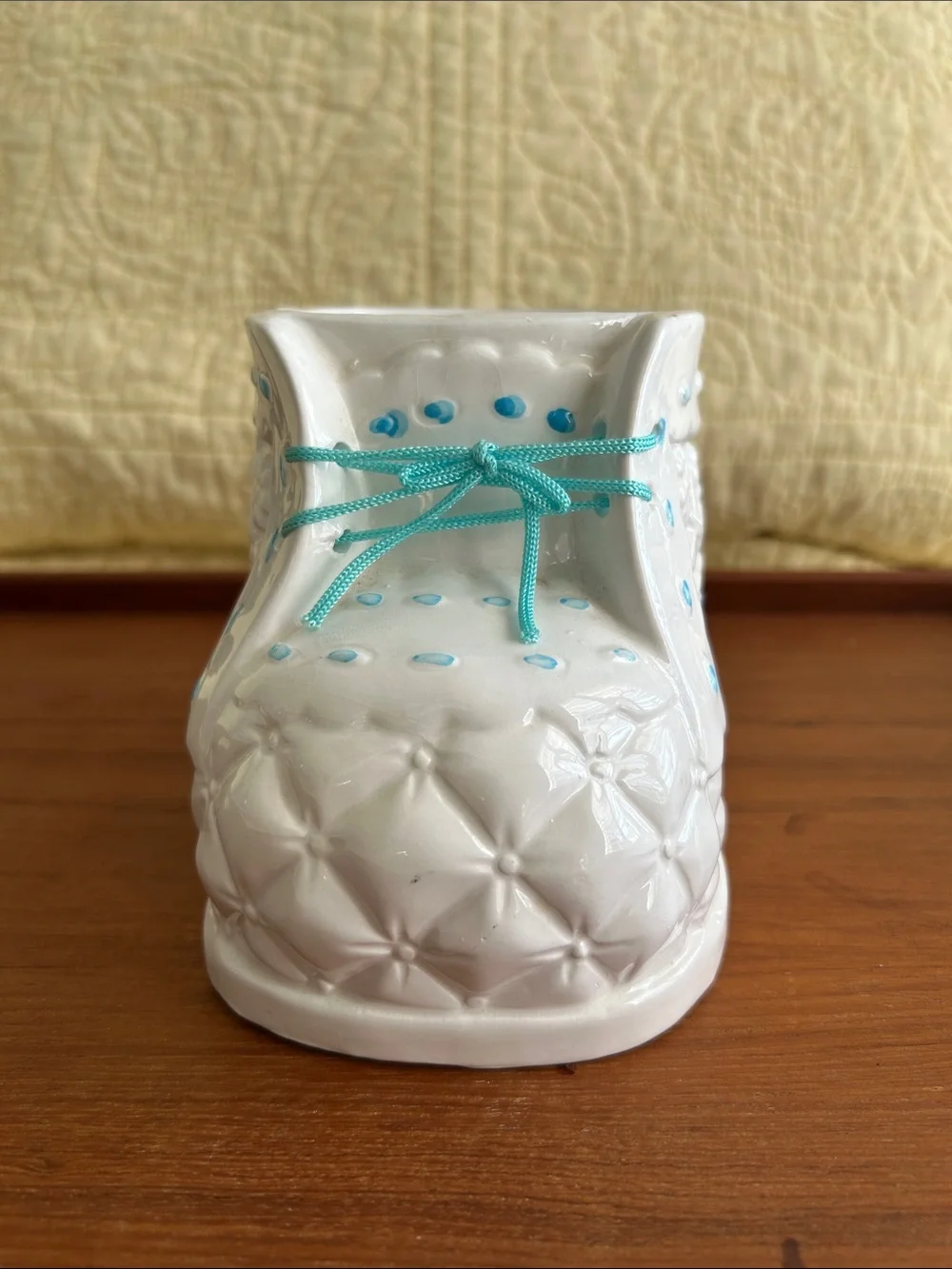 Vintage Ceramic baby bootie planter Embossed floral design and turquoise ribbon.